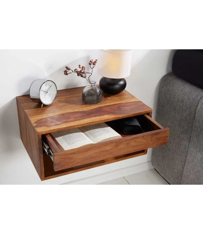 Zwevend kastje met open la met boek erin